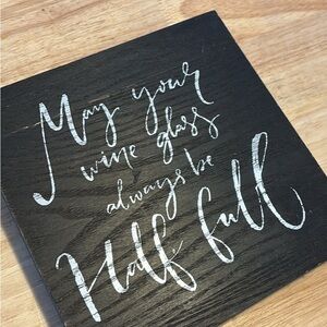 Black Wooden Sign with White Script